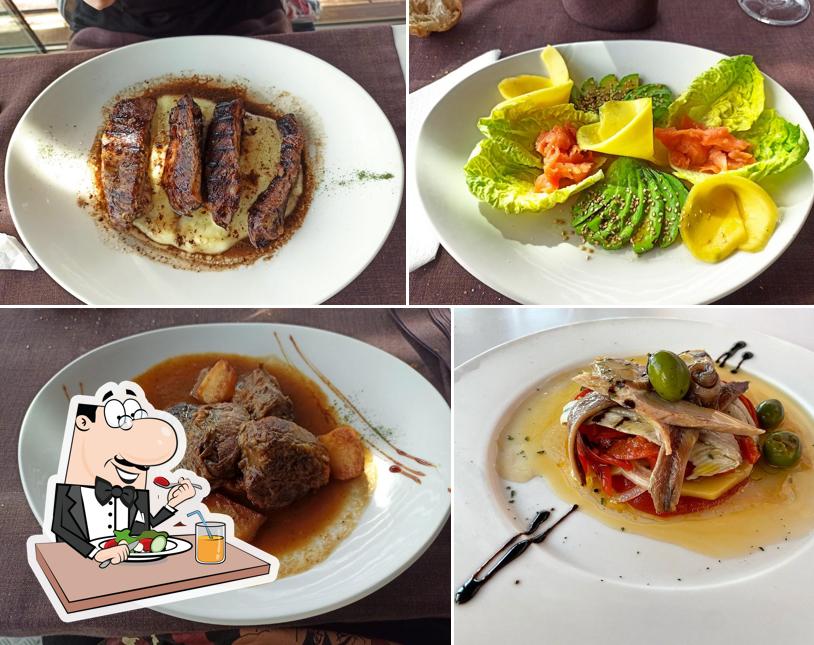 Sarbil review photo showing a smoked salmon and avocado salad among other dishes