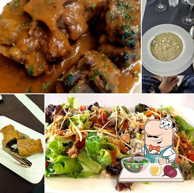 Sarbil review photo with a large salad and plated dishes